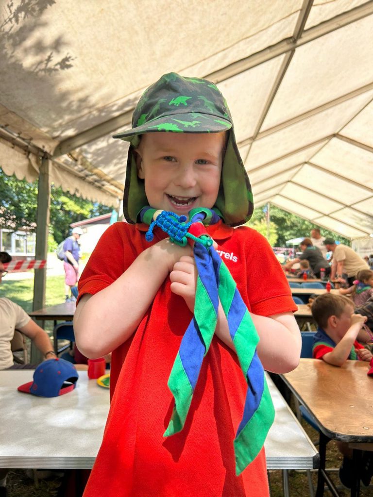 Squirrel Scout proudly showing off his new woggle #DringyGroupCamp25