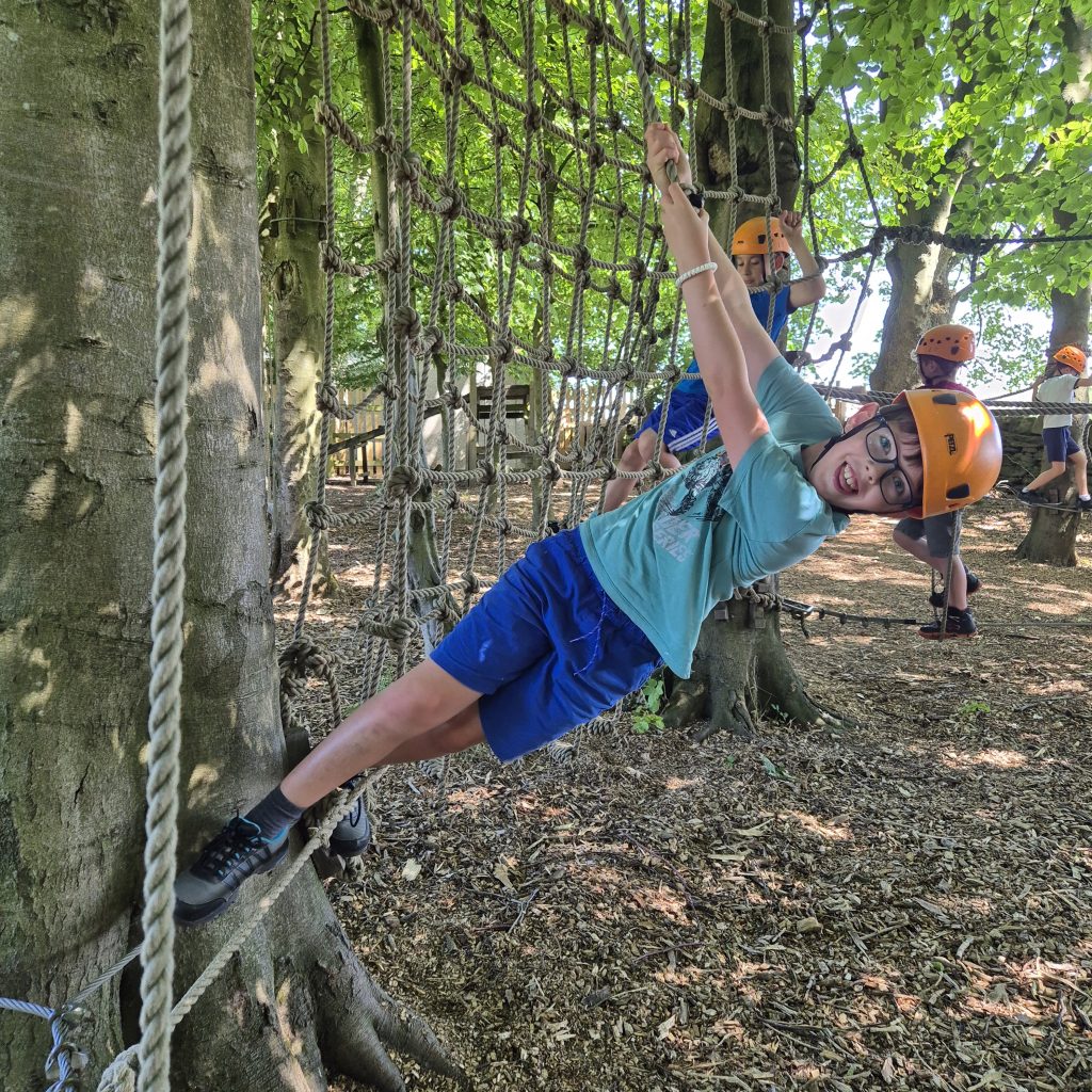 hanging on as going round the low ropes course. #DringyGroupCamp25