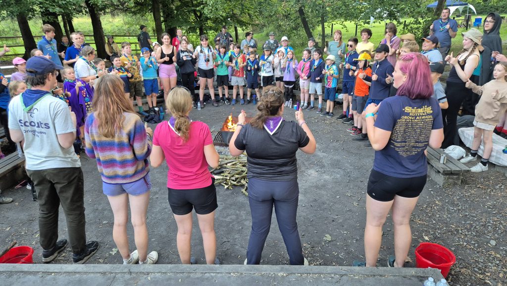 Explorer Scouts running campfire songs. #DringyGroupCamp25