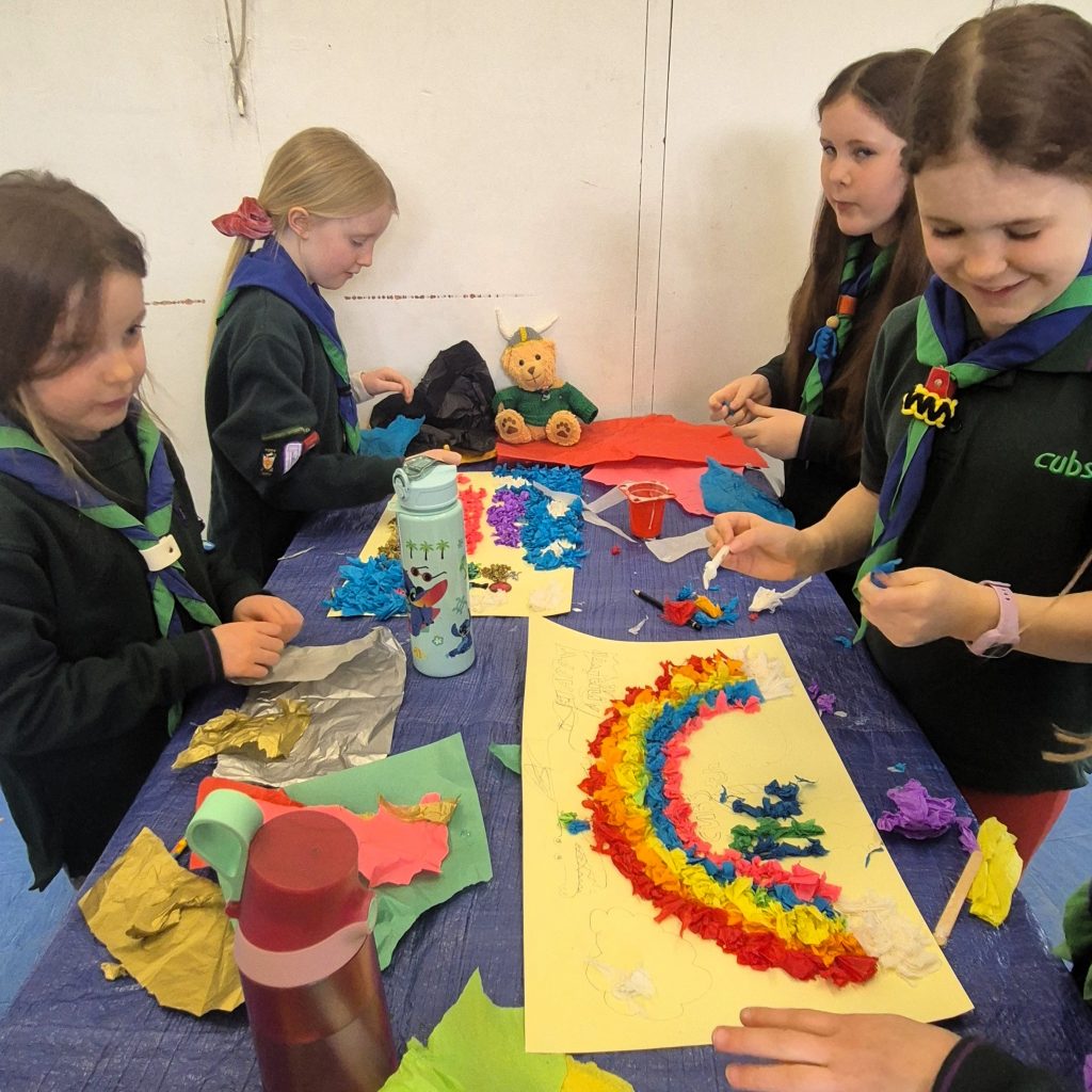 Cubs working together to create a poster