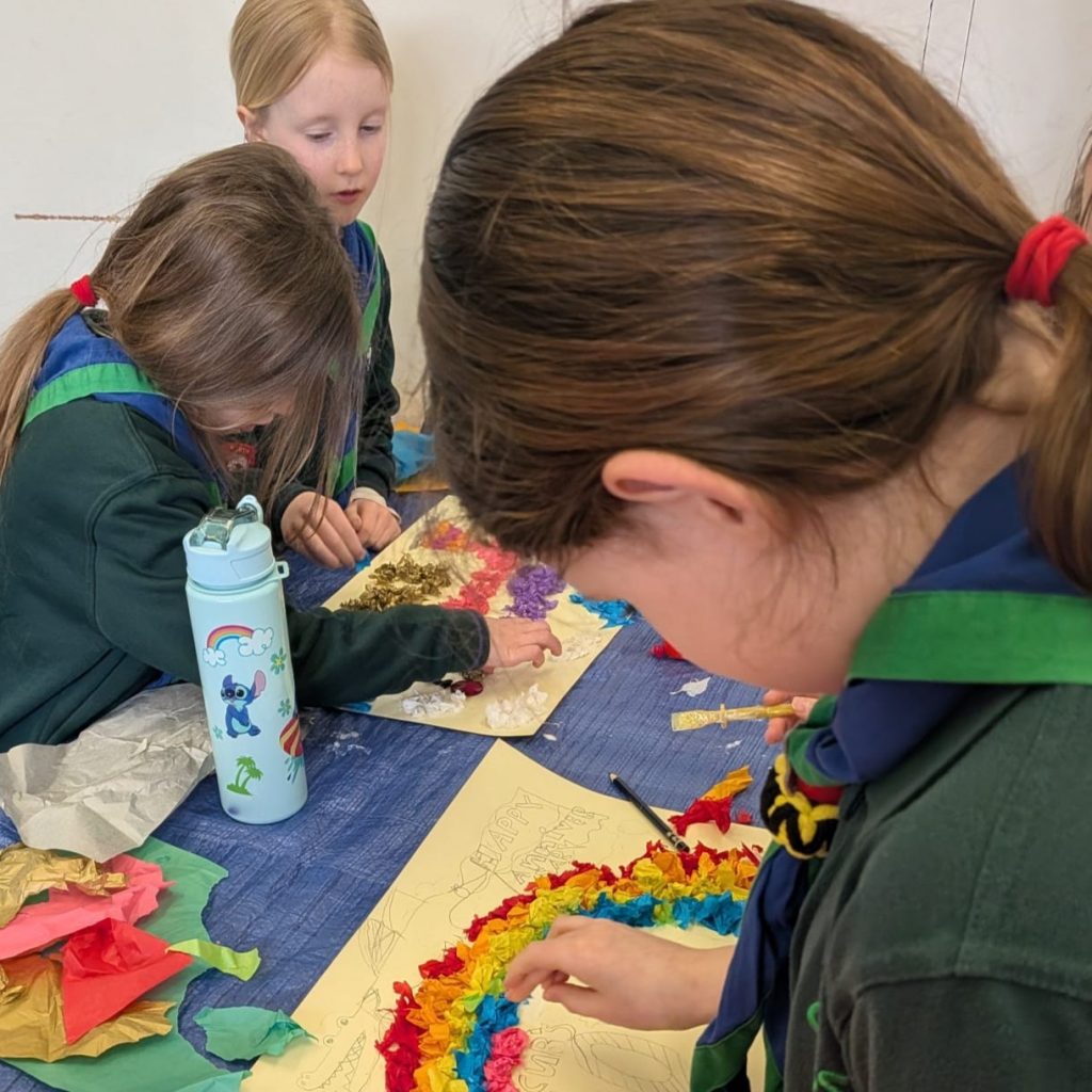 Cubs working together to create a poster