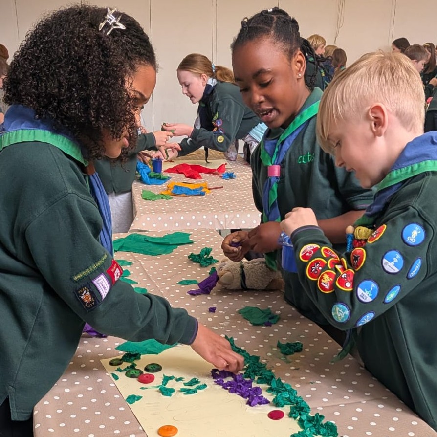 Cubs working together to create a poster