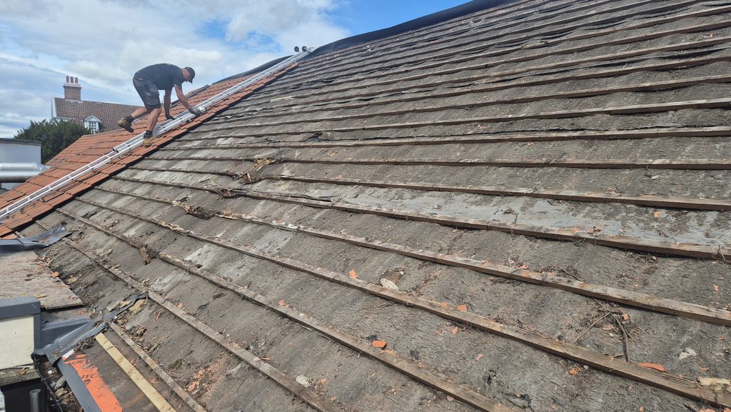 Under the broken tiles, the front roof of Dringhouses Scouts HQ